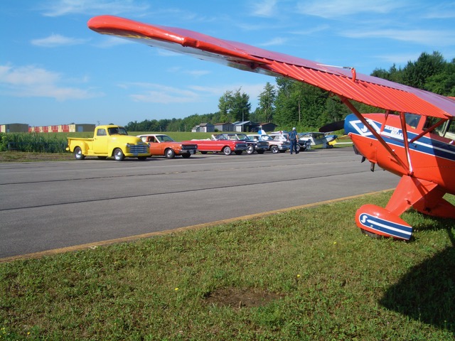 car show and small aircraft at the county airport